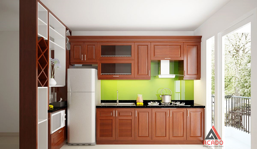 Tủ bếp 2020 hình chữ i làm từ gỗ xoan đào màu cánh dán với điểm nhấn là tâm kính ốp màu xanh