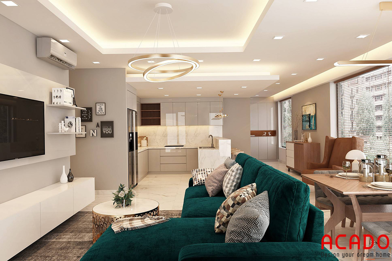 Toàn bộ không gian phòng khách sự dụng tone màu sáng nhẹ nhàng điểm nhấn là bộ sofa màu xanh rêu